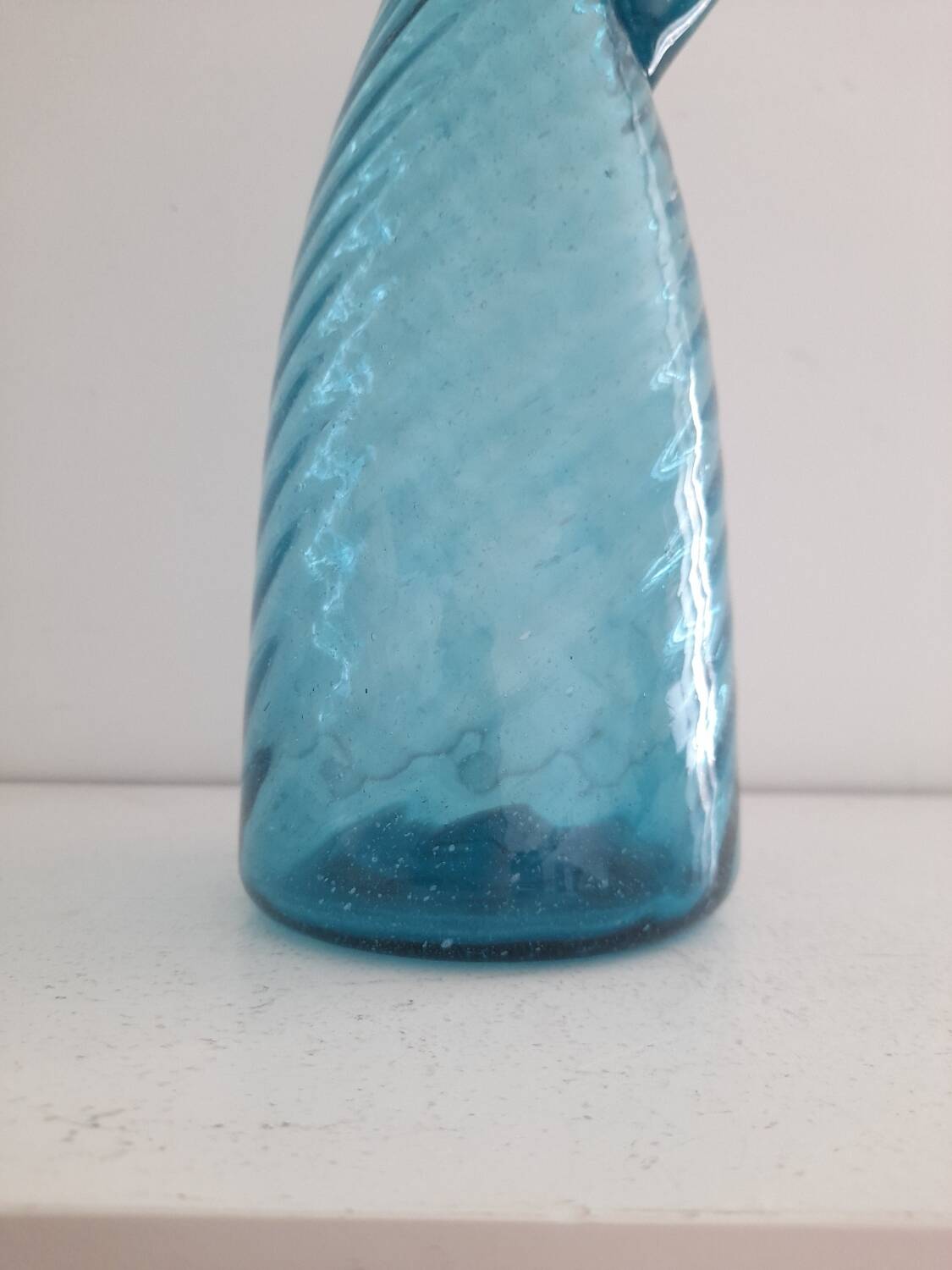 Tall twisted blue glass carafe