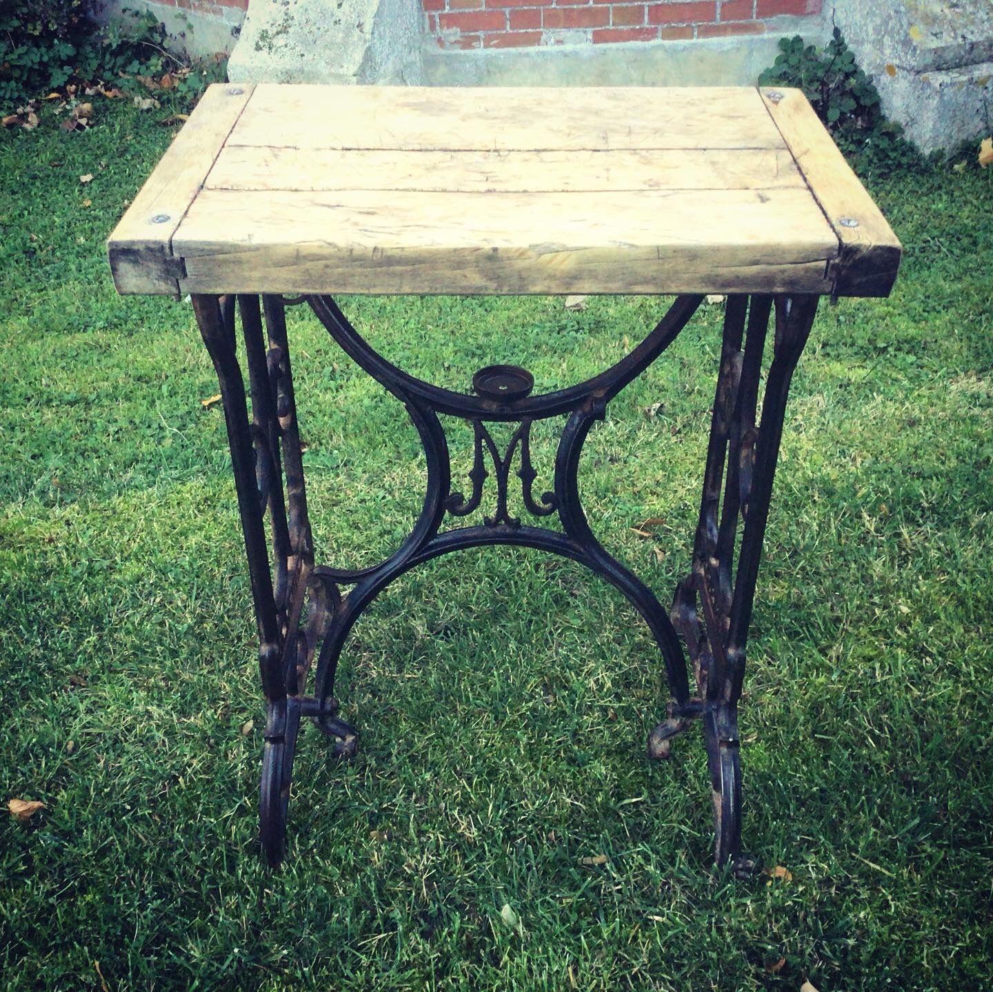 Established solid wood and cast iron console