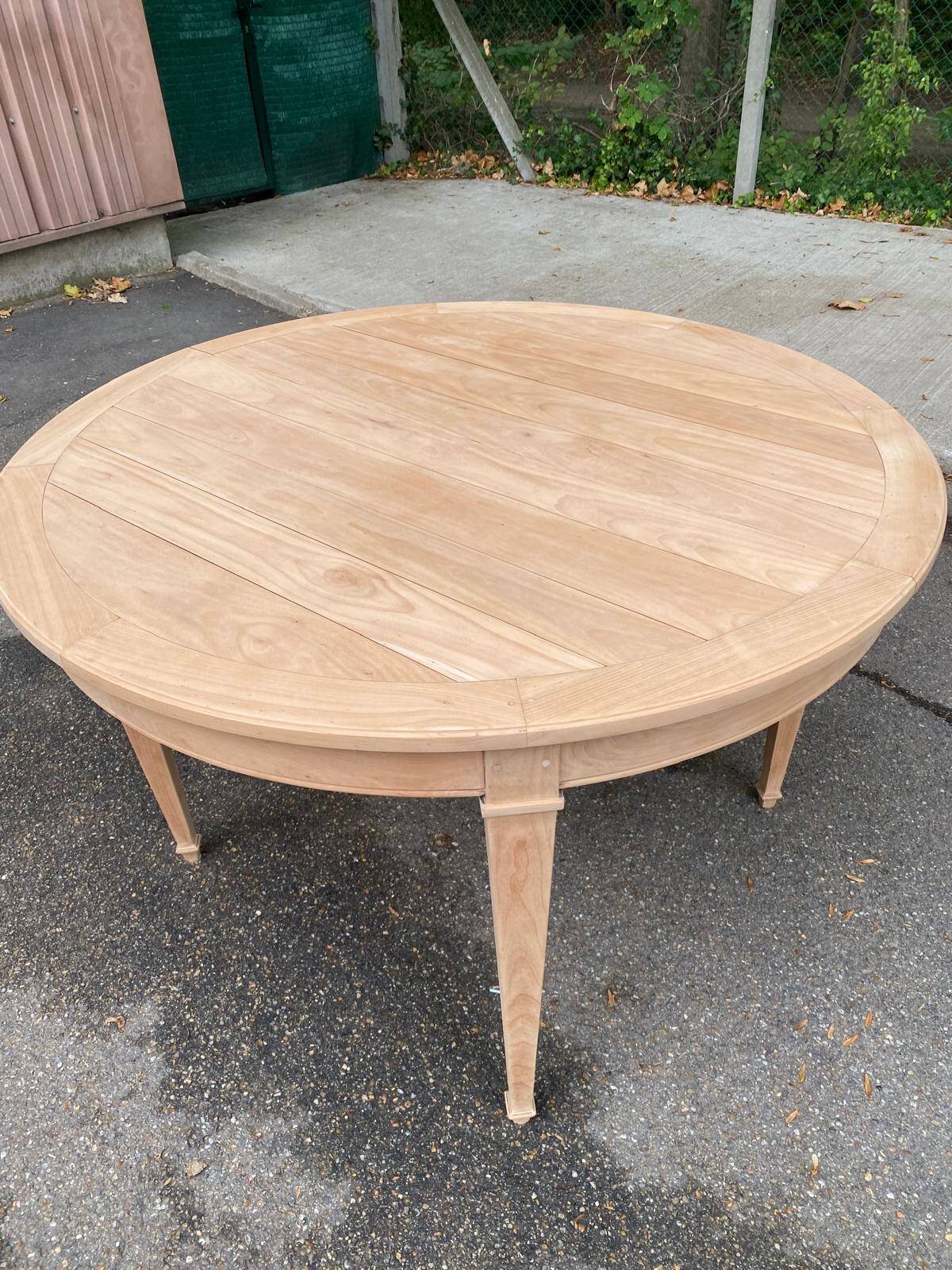Round extendable dining table stripped in cherry wood Louis XVI René Trotel 1