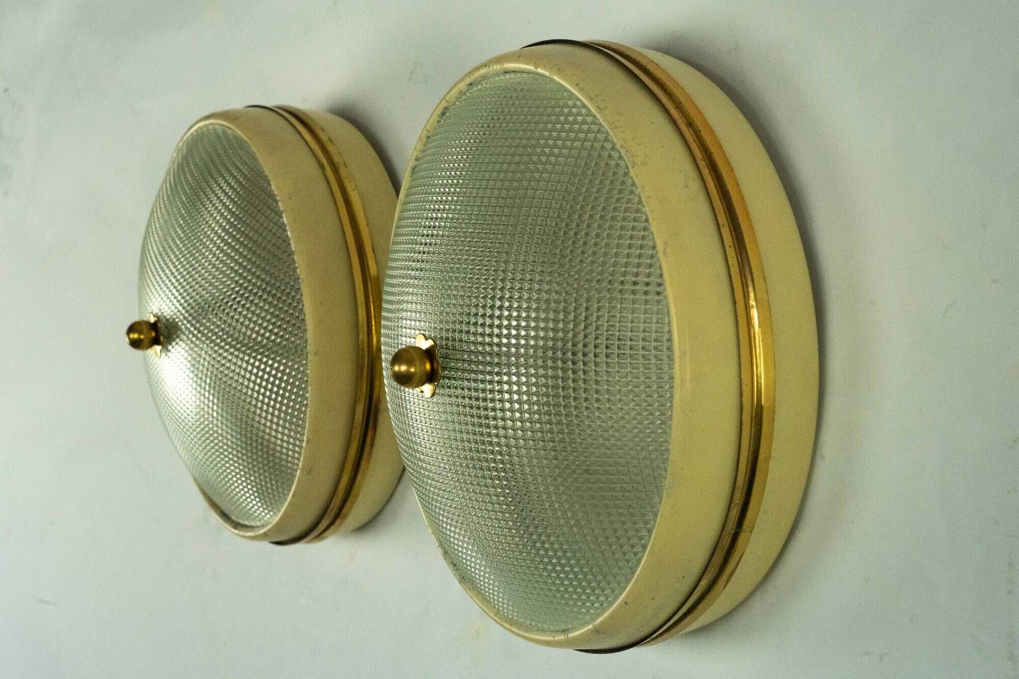 Lumi Milano, pair of wall or ceiling lamps in glass, brass and lacquer, 50s