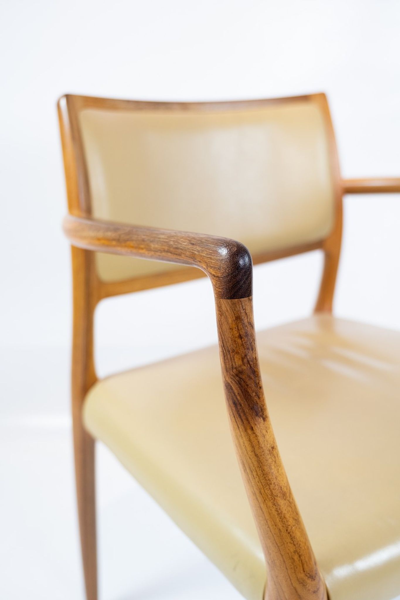 Pair of N.O. Moeller armchairs, model 65, in rosewood and light leather