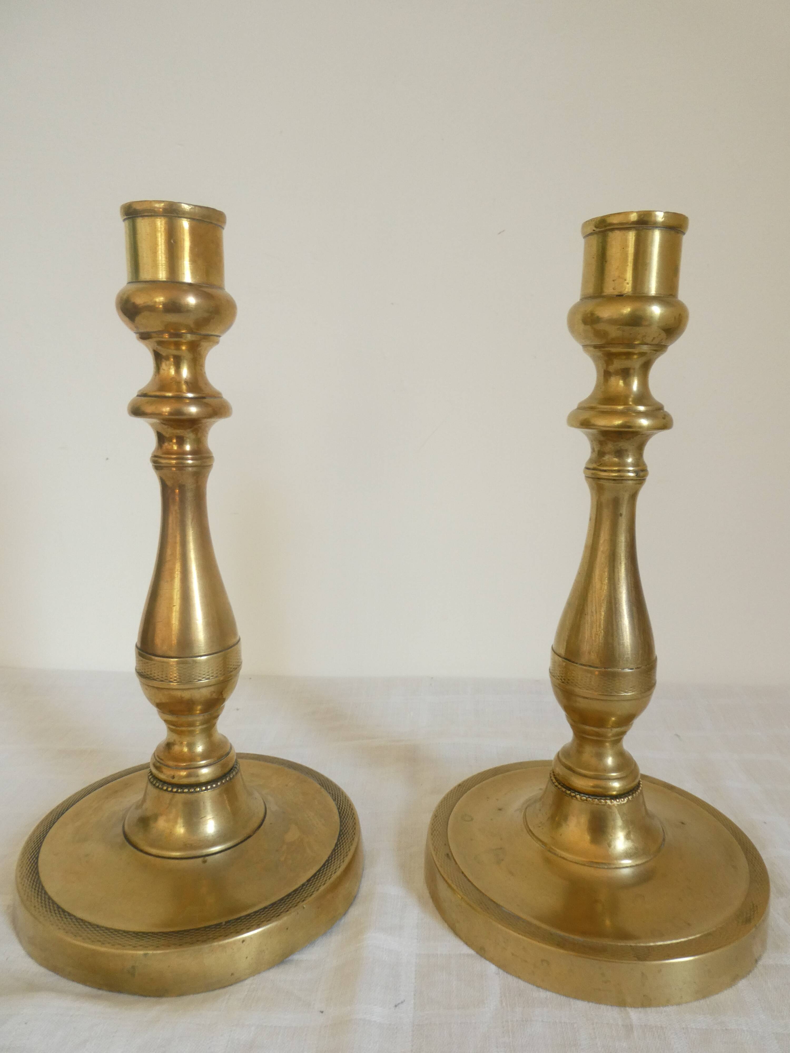 Pair of bronze candlesticks from the Restoration period, circa 1820