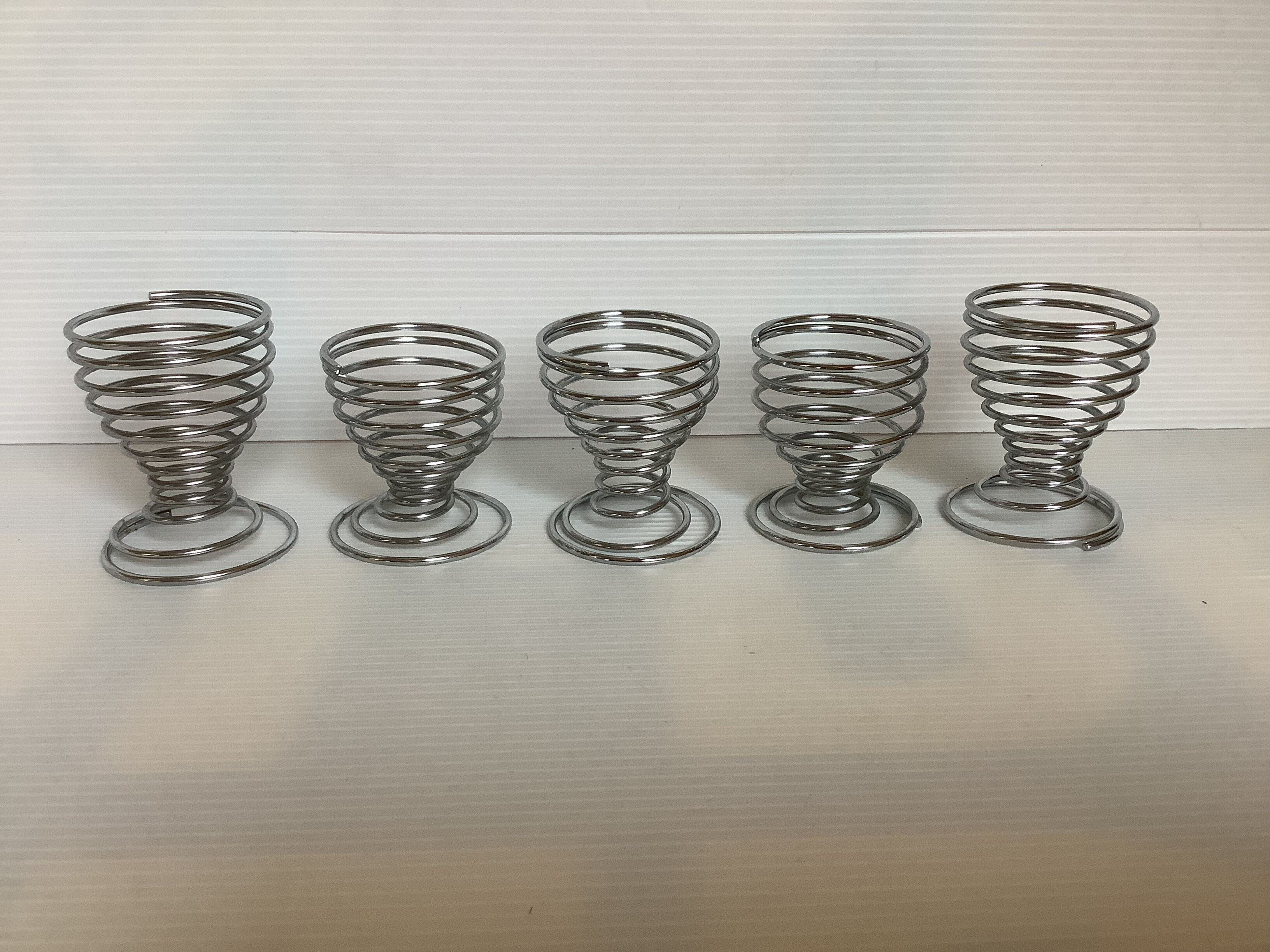 Five spiral spring eggcups