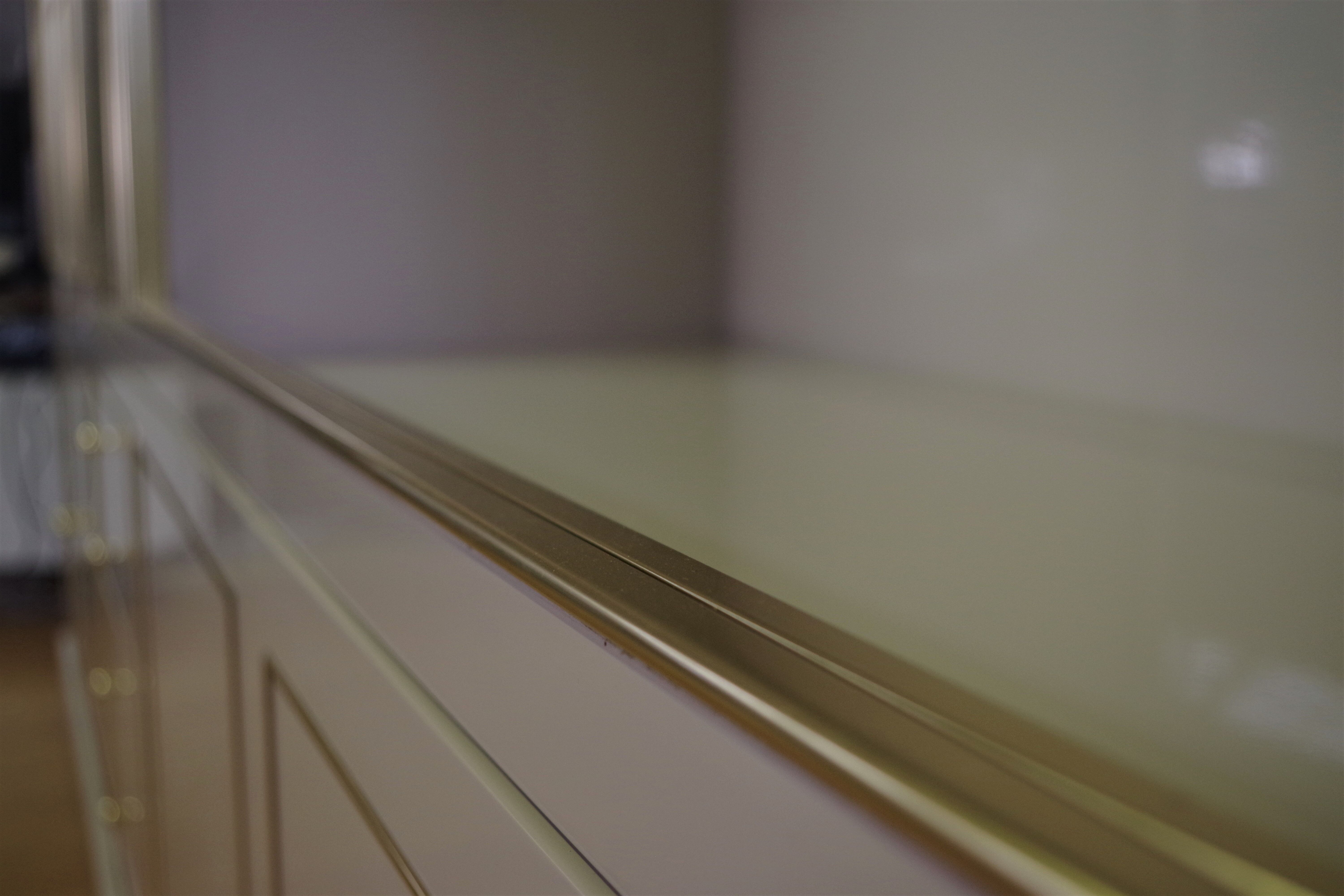 Showcases in lacquered wood, glass and brass  1970s, set of 4