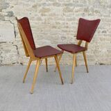 Pair of wooden chairs and red skai, 50s