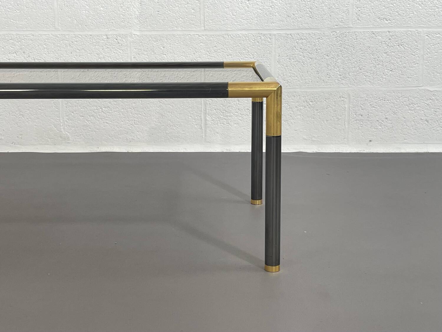 Gunmetal gold metal and smoked glass coffee table from the 70s