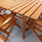 Vintage garden furniture set consisting of a table with extensions and 4 armchairs