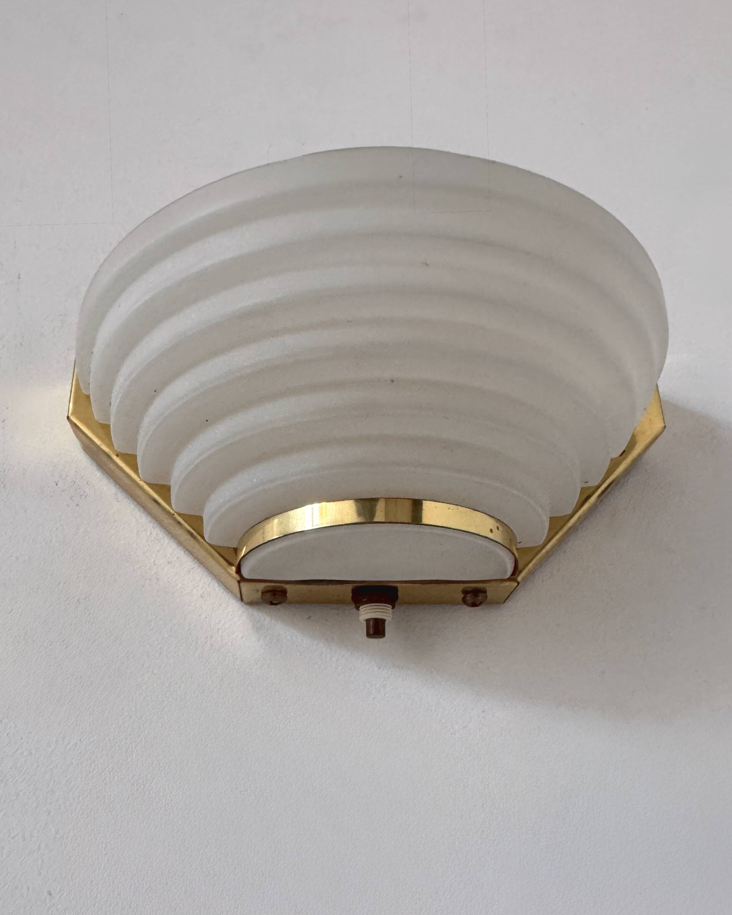 Pair of vintage brass and frosted glass wall lights, France, 1970.