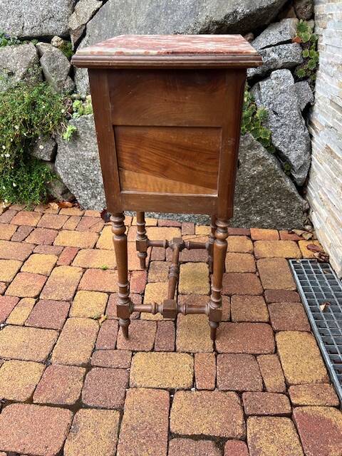 Wooden bedside table with marble top