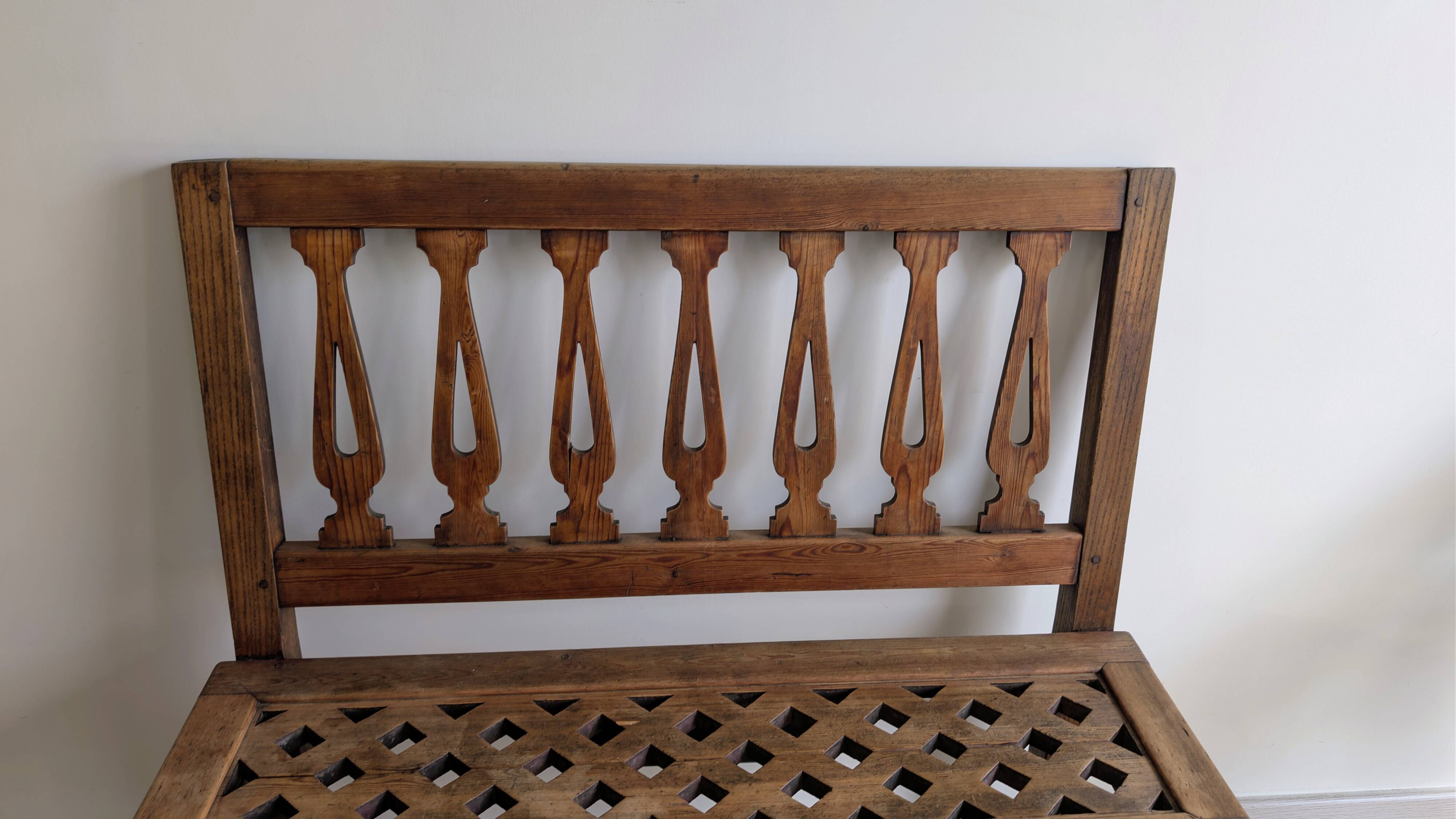 Old church bench in pitch pine, rustic charm and authentic patina.