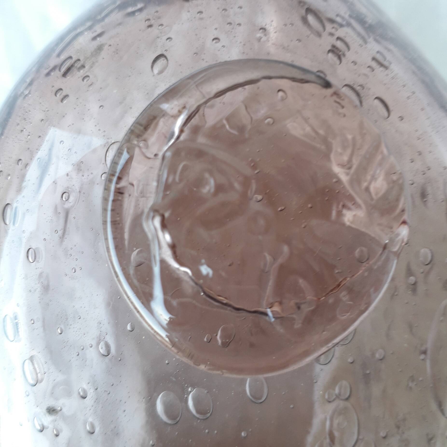 Biot bottle in bubbled glass