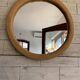 Vintage 1950s round wall mirror, wooden frame and mirror, yellow finish.