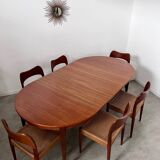 Round teak table with Scandinavian design extensions from the 60s vintage