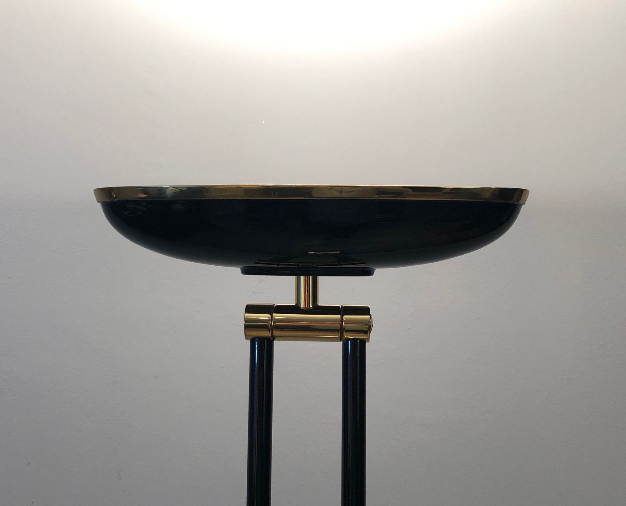 Black lacquered metal floor lamp with brass.
