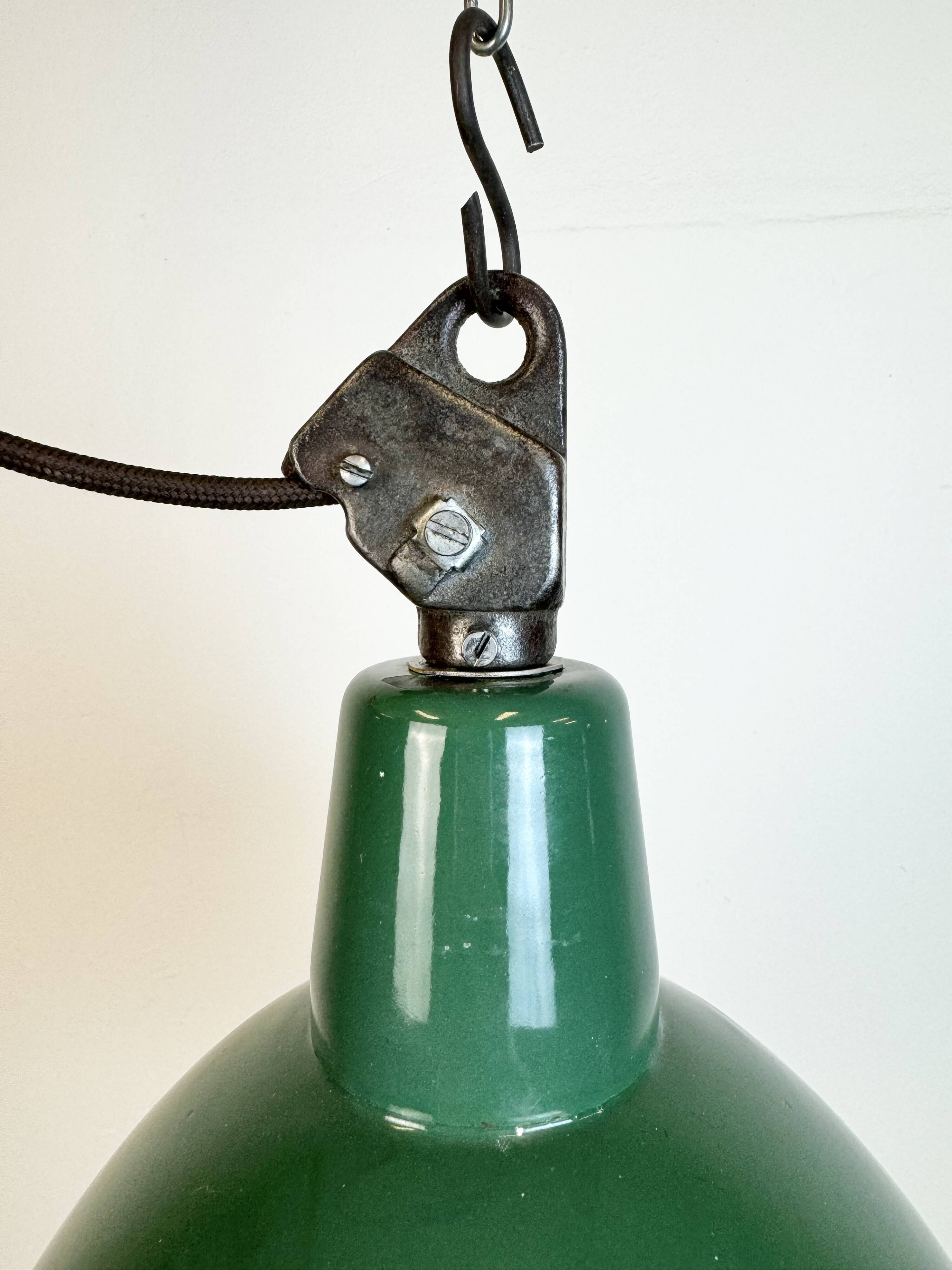 Industrial green enamel factory lamp with cast iron top, 1960s