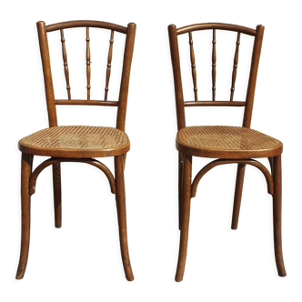 2 bistro chairs seated tanned