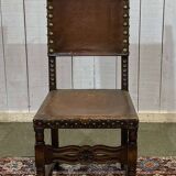High-backed chair from the early 20th century in oak and leather