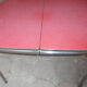 Vintage table of the 60s in red formica and chrome legs