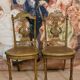 Paire de chaises de musiciens en bois sculpté et doré de style Louis XVI