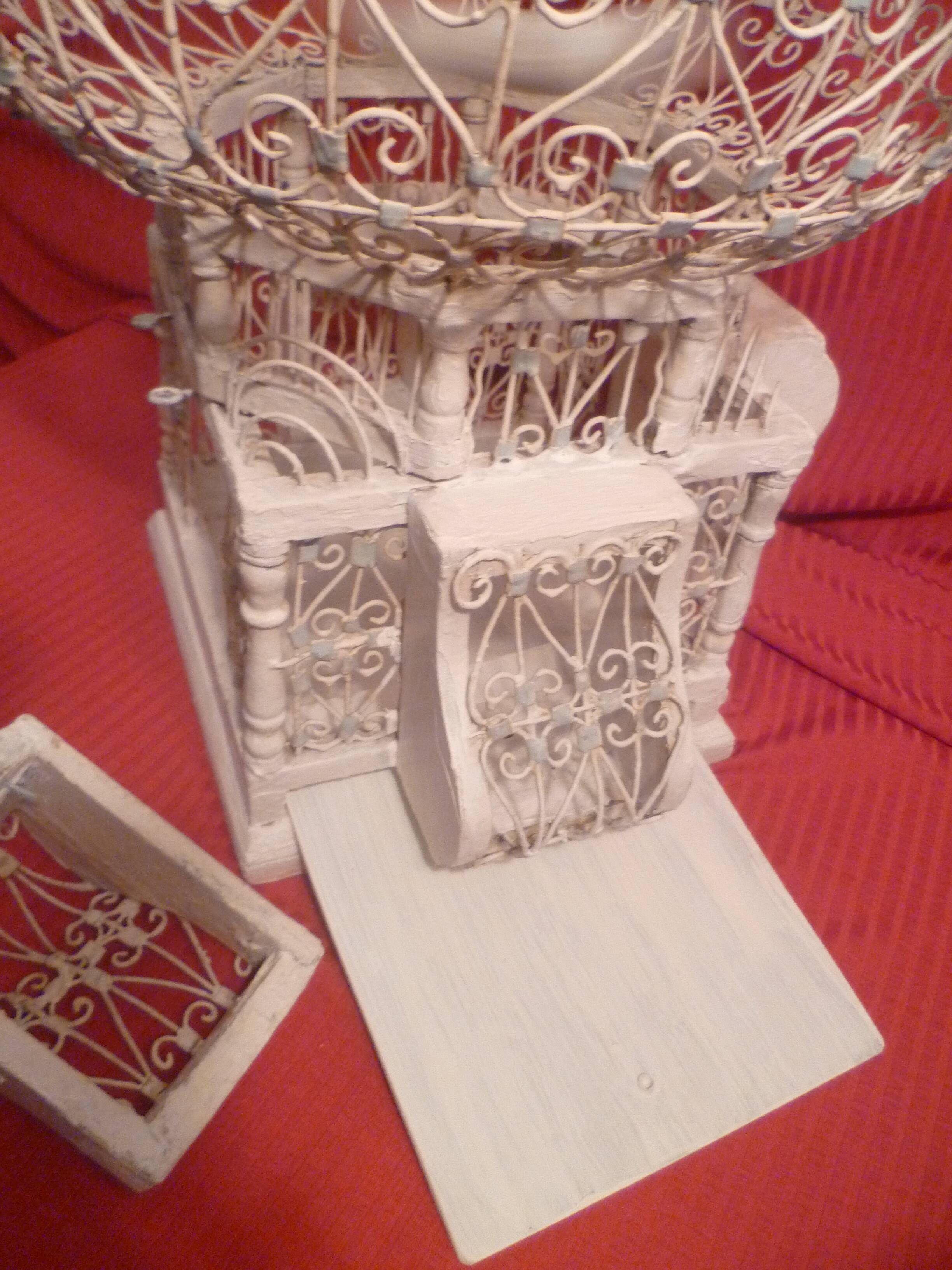 Antique handmade birdcage in metal and wood