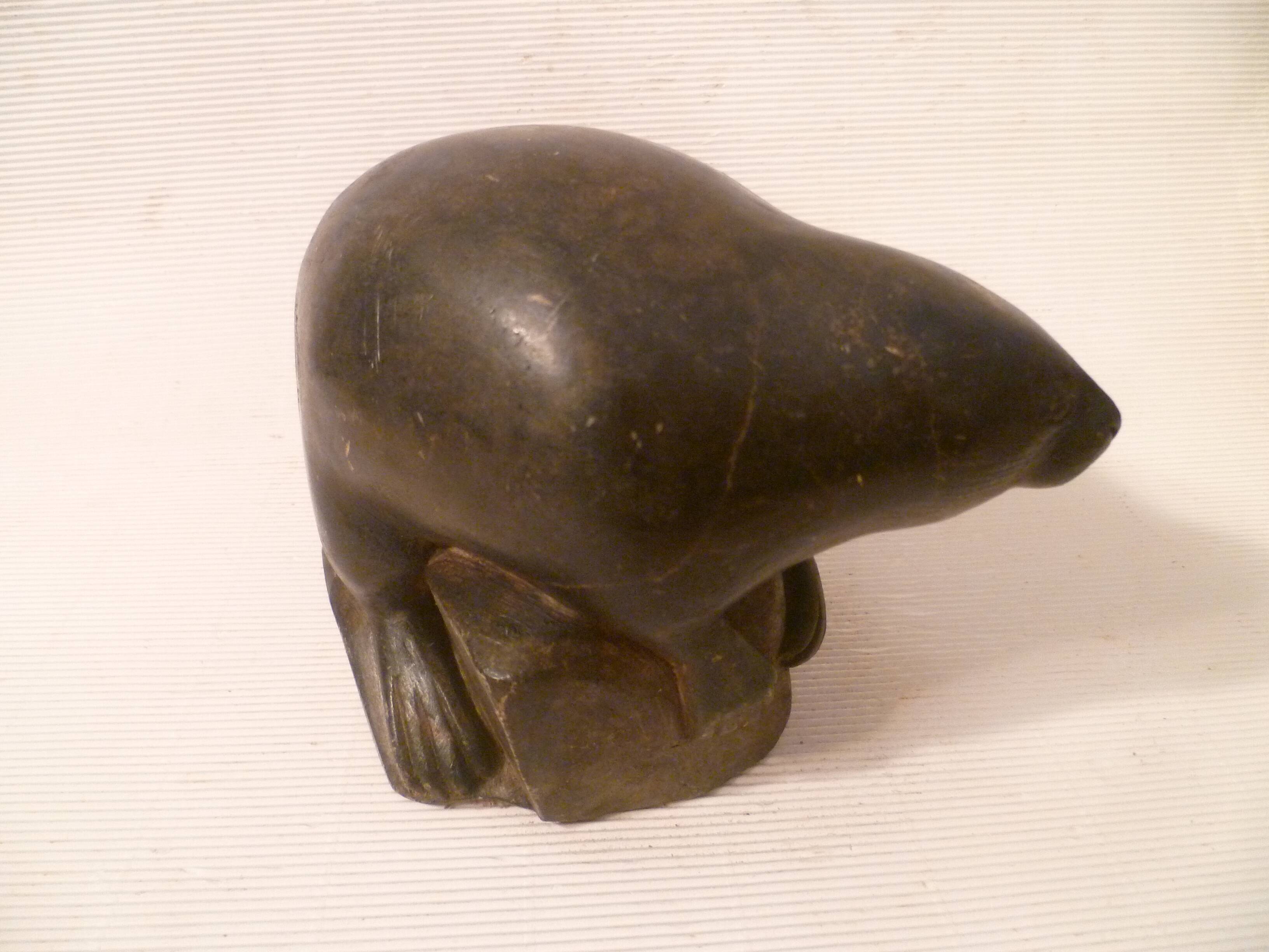 Ancient inuit seal sculpture in stone