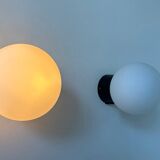 Pair of vintage Raak opaline and Bakelite wall lights, Netherlands 1970s