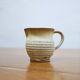 Série de 4 tasses et un pot à lait vintage en grès