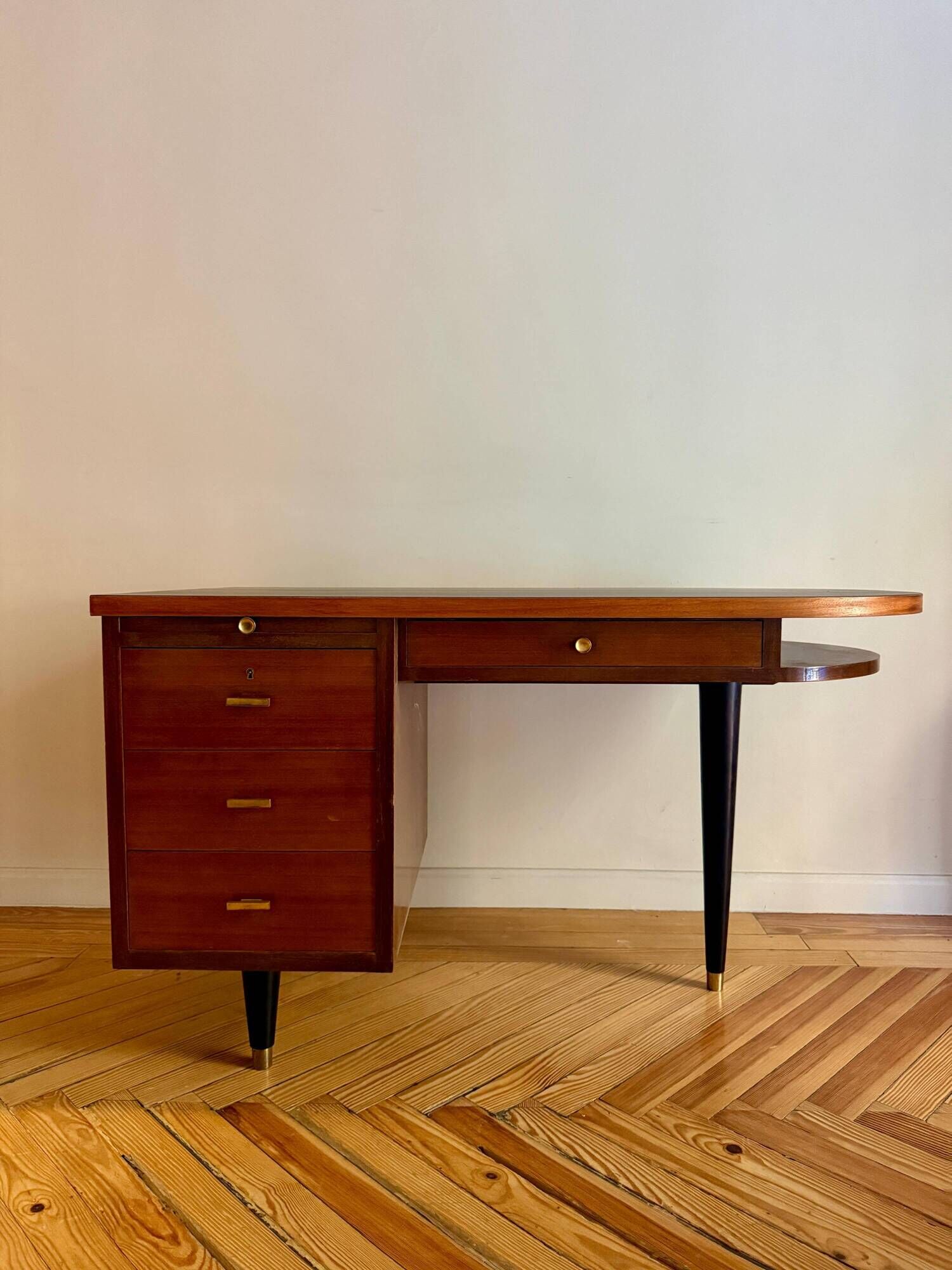 French desk "Prouve" in walnut, bronze and rubber from the 1970s.