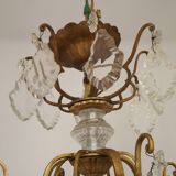 French Louis XV chandelier with 8 lights in gilded bronze, glass and crystal.