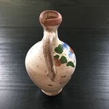 Small old amphora with floral decoration