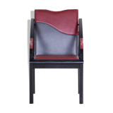 Fauteuil des années 1970 fabriqué en Europe. Fabriqué en bois laqué et cuir, original