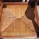 Pair of oak armchairs with straw seats and backs.