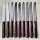 Set de 9 couteaux de table vintage inox et bakélite brune
