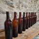 Set of 10 bottles of old Bordeaux French wine in ruby brown glass, 19th century.
