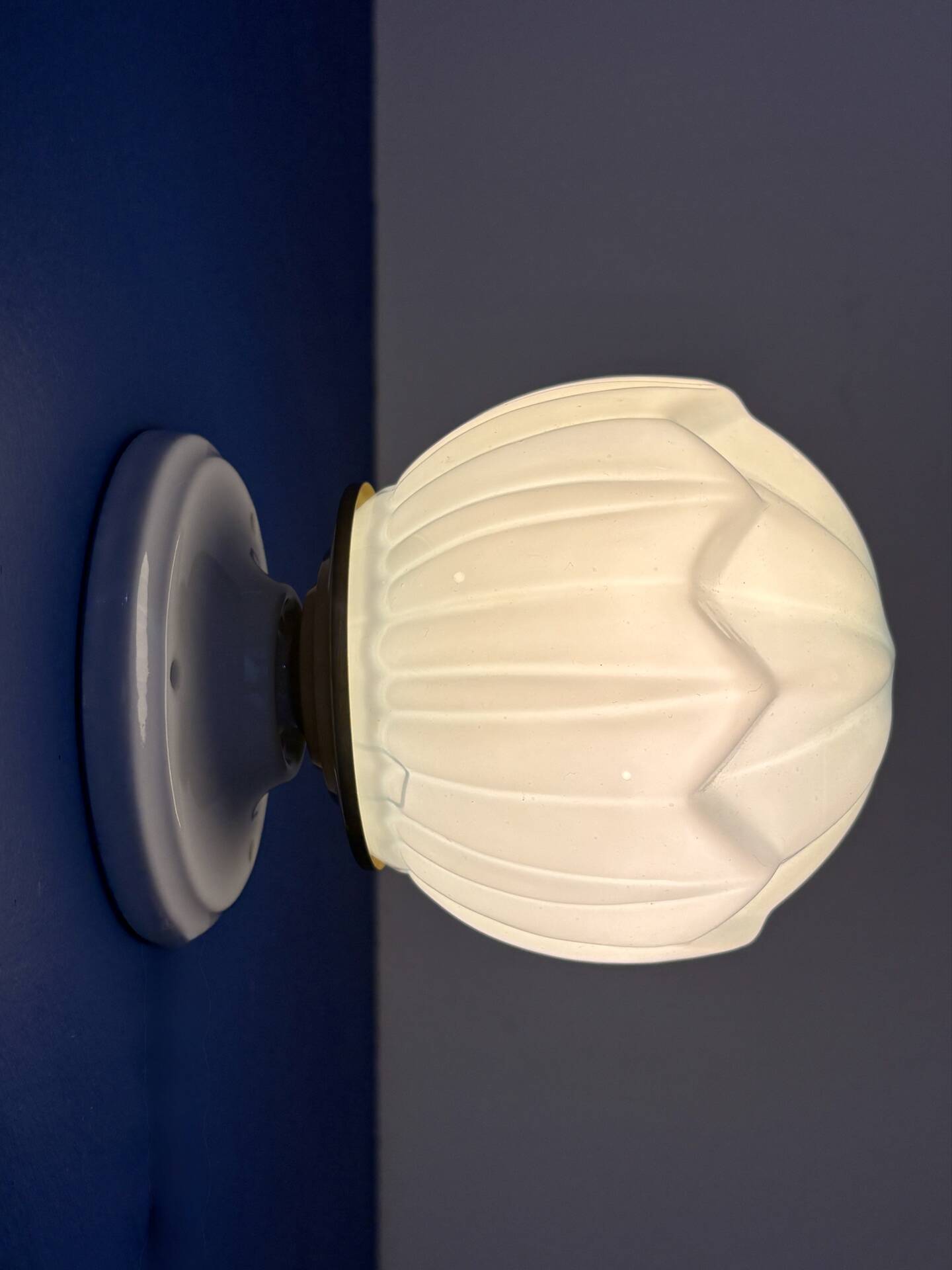 Vintage Art Deco globe wall light in blue opaline.