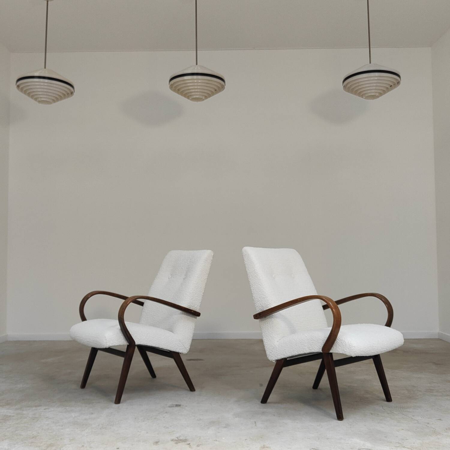 Pair of Jaroslav Smidek armchairs for Ton Bystrice, restored with white boucle, 1960.