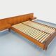 Double bed vintage Scandinavian in teak from the 1960s with integrated bedside tables.