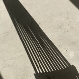 Foldable designer armchair in wooden slats