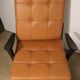 Paire de fauteuils vintage années 50 en bois noir et cuir caramel