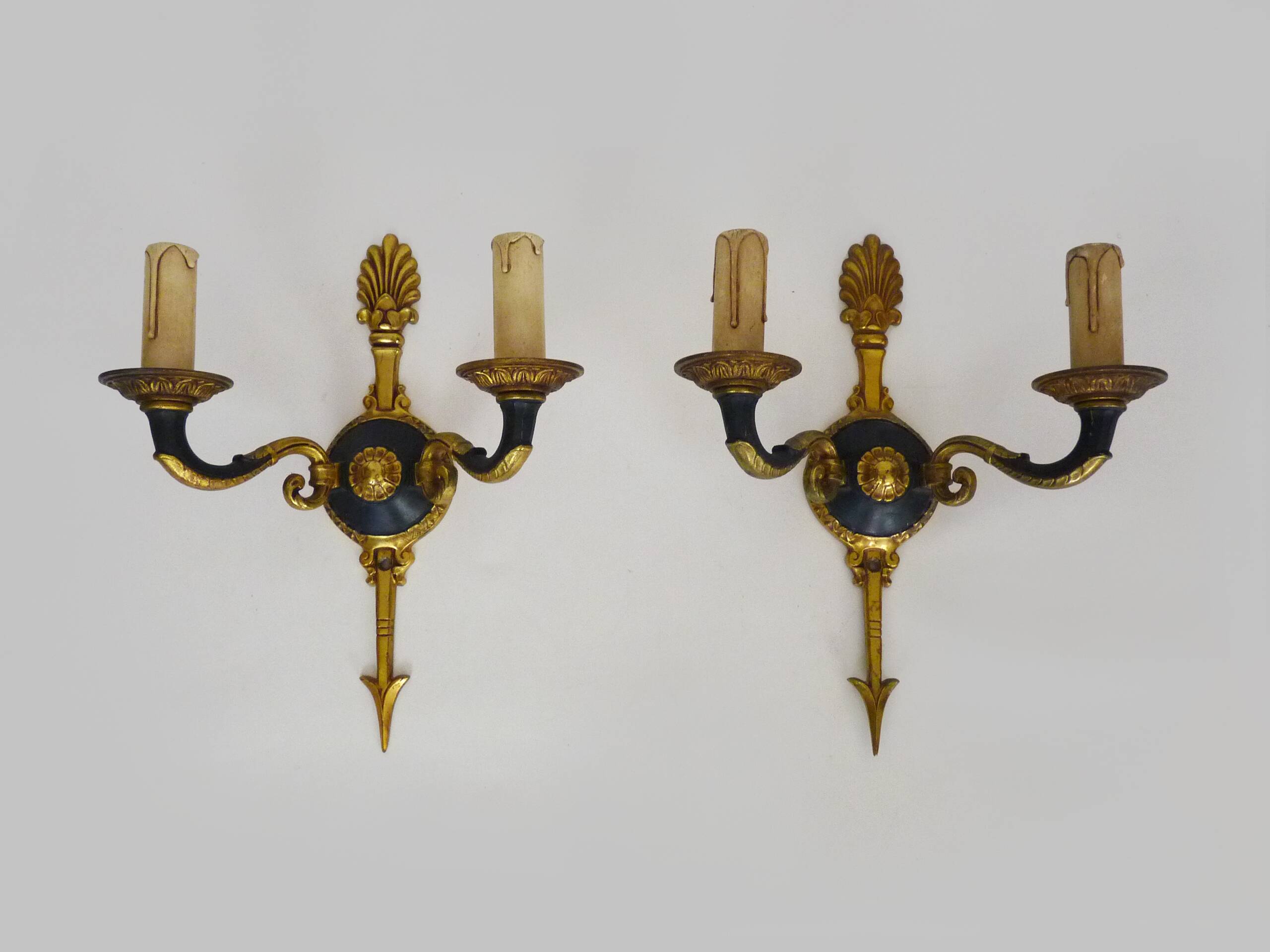 Pair of wall sconces in the Empire style with double lights in bronze.