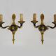 Pair of wall sconces in the Empire style with double lights in bronze.