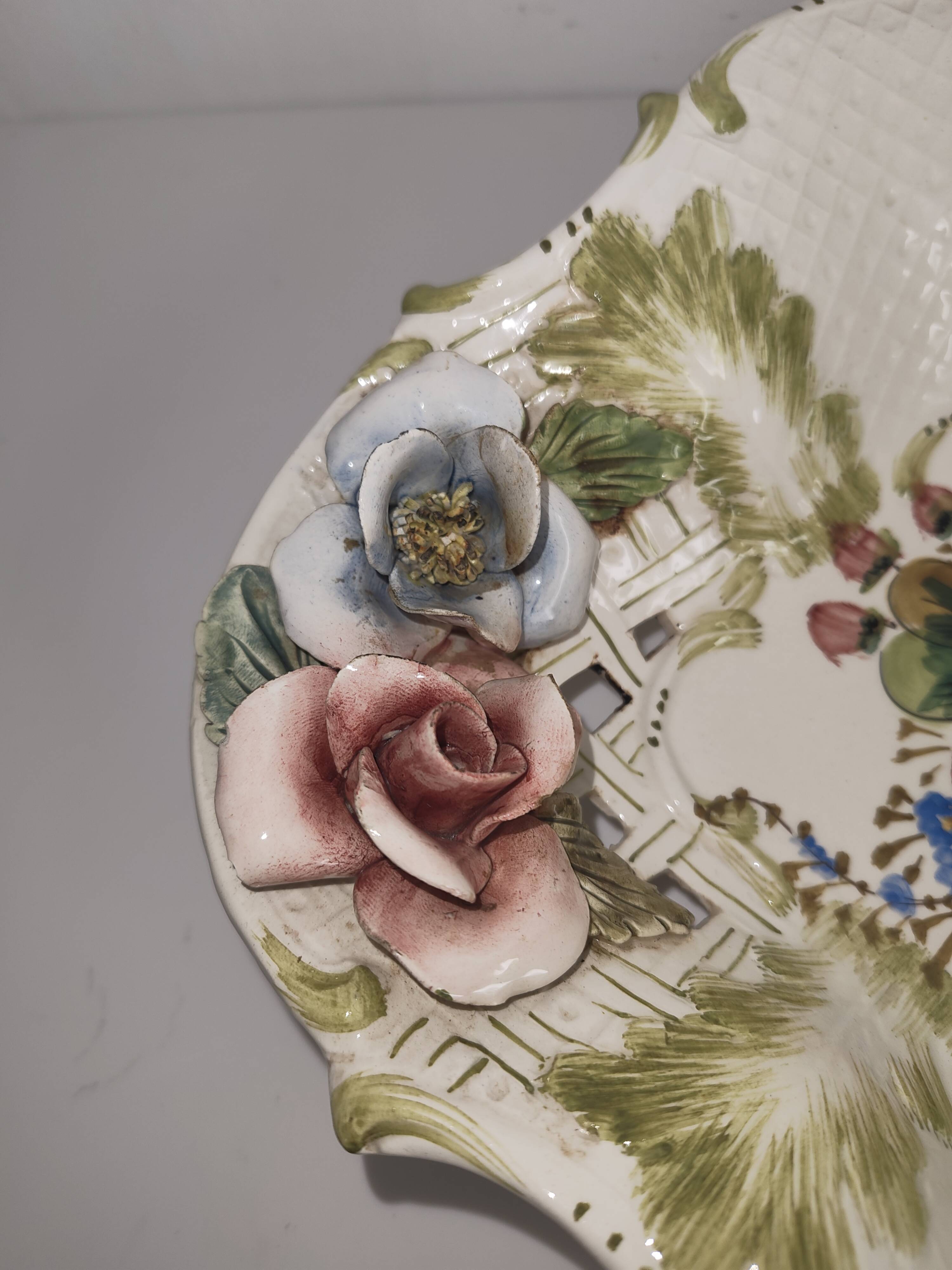 Openwork ceramic bowl with raised flower decoration in Italian style.
