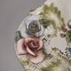 Openwork ceramic bowl with raised flower decoration in Italian style.