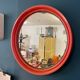 Round orange mirror Gilac for Prisunic