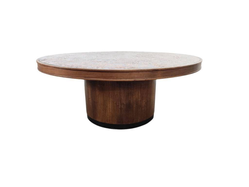 Vintage round wooden coffee table with a copper top.