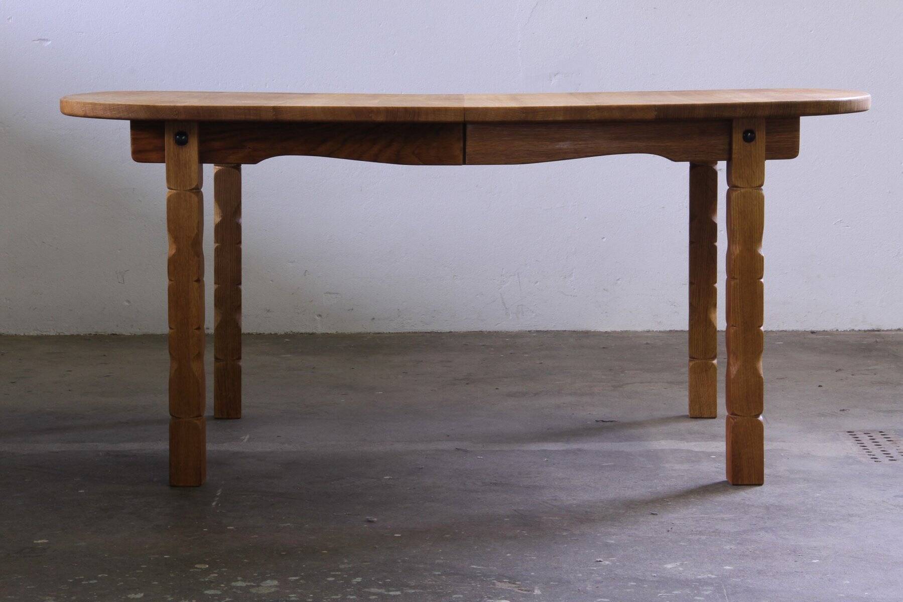 Vintage Danish brutalist oval extendable oak dining table in the style of Henning Kjærnulf, 1960s