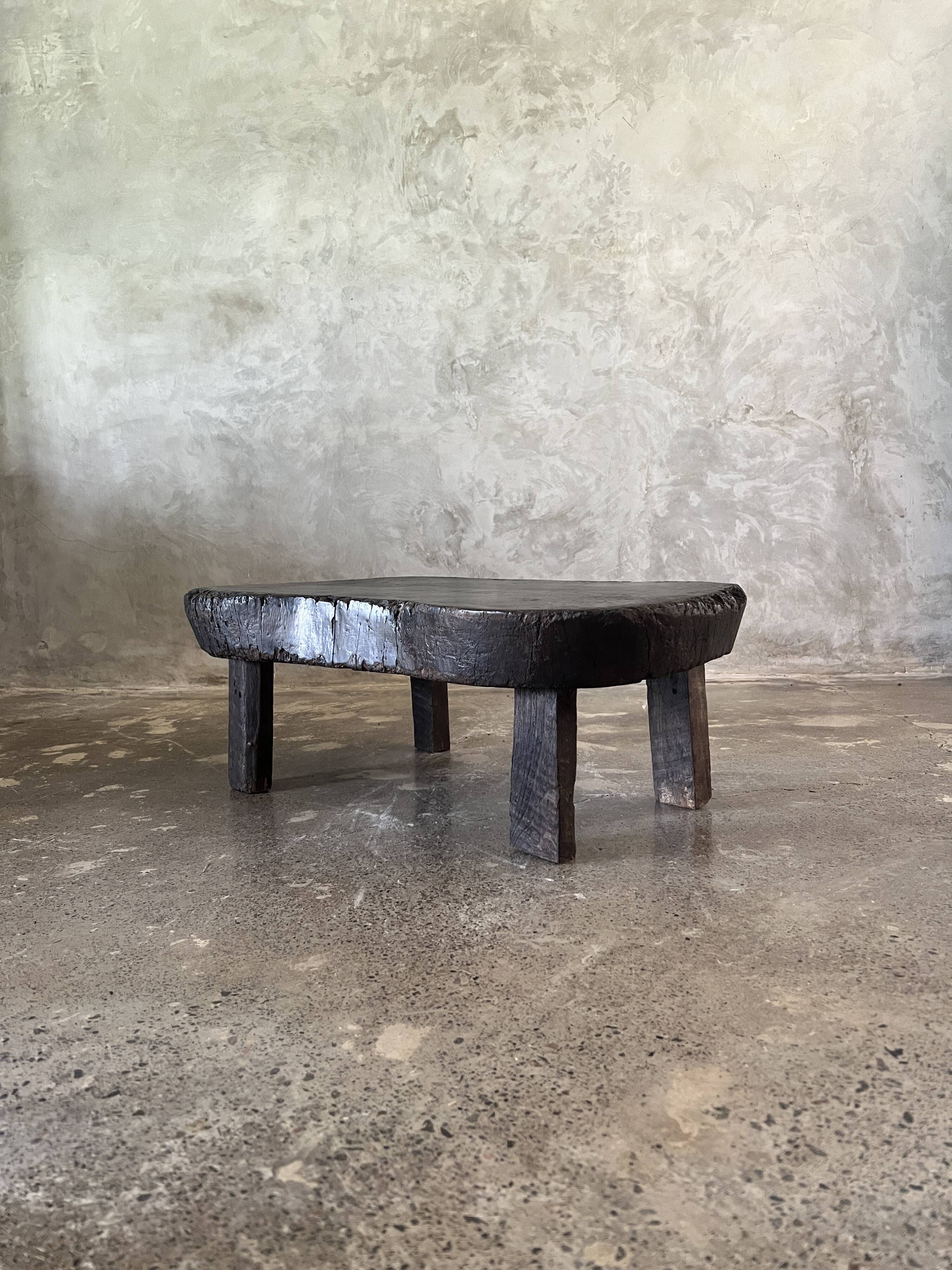 Small old Asian wooden coffee table in Japanese style, kidney-shaped top