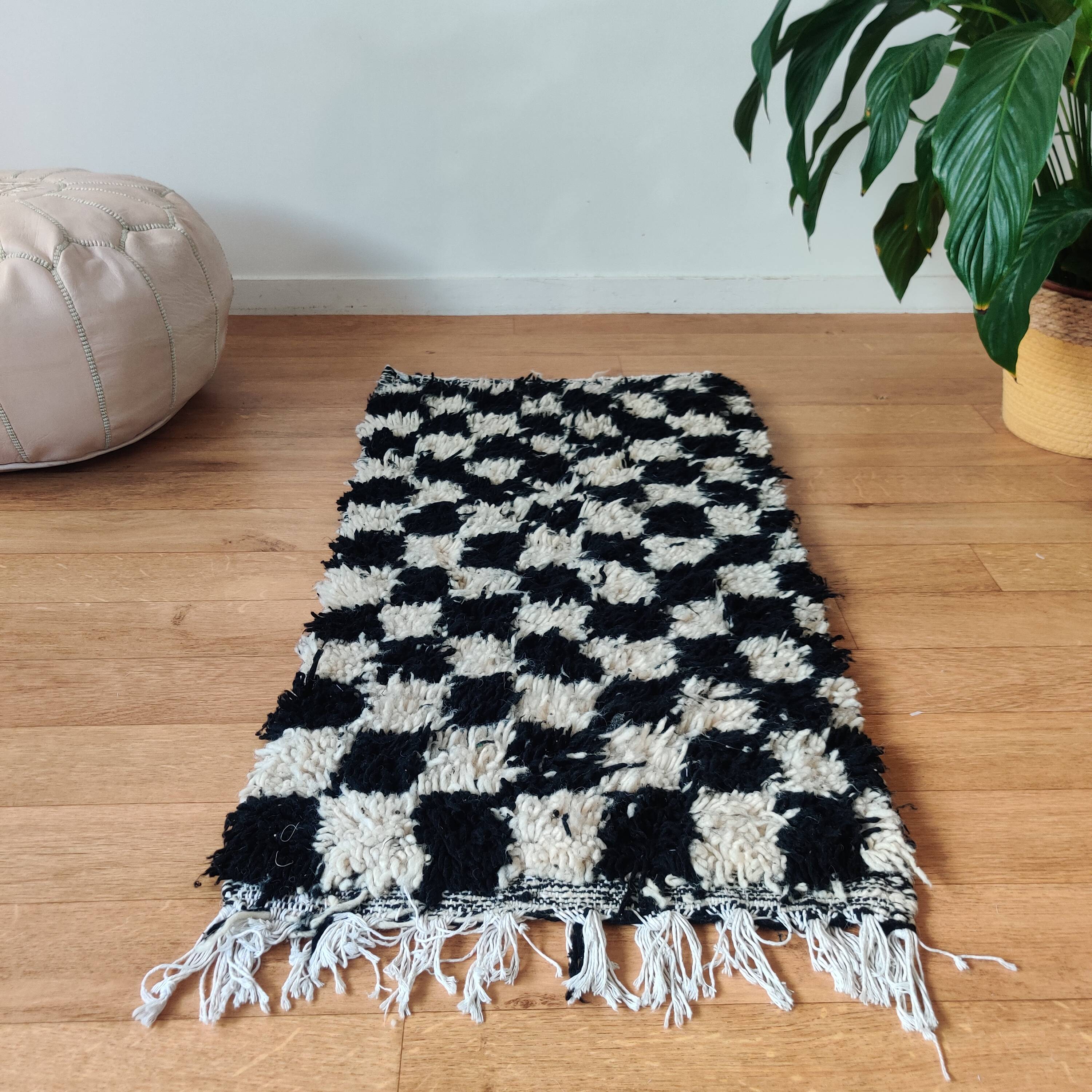 Small black tile Berber rug
