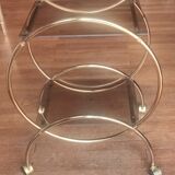 Service console with design / gilded metal wheels and smoked glass