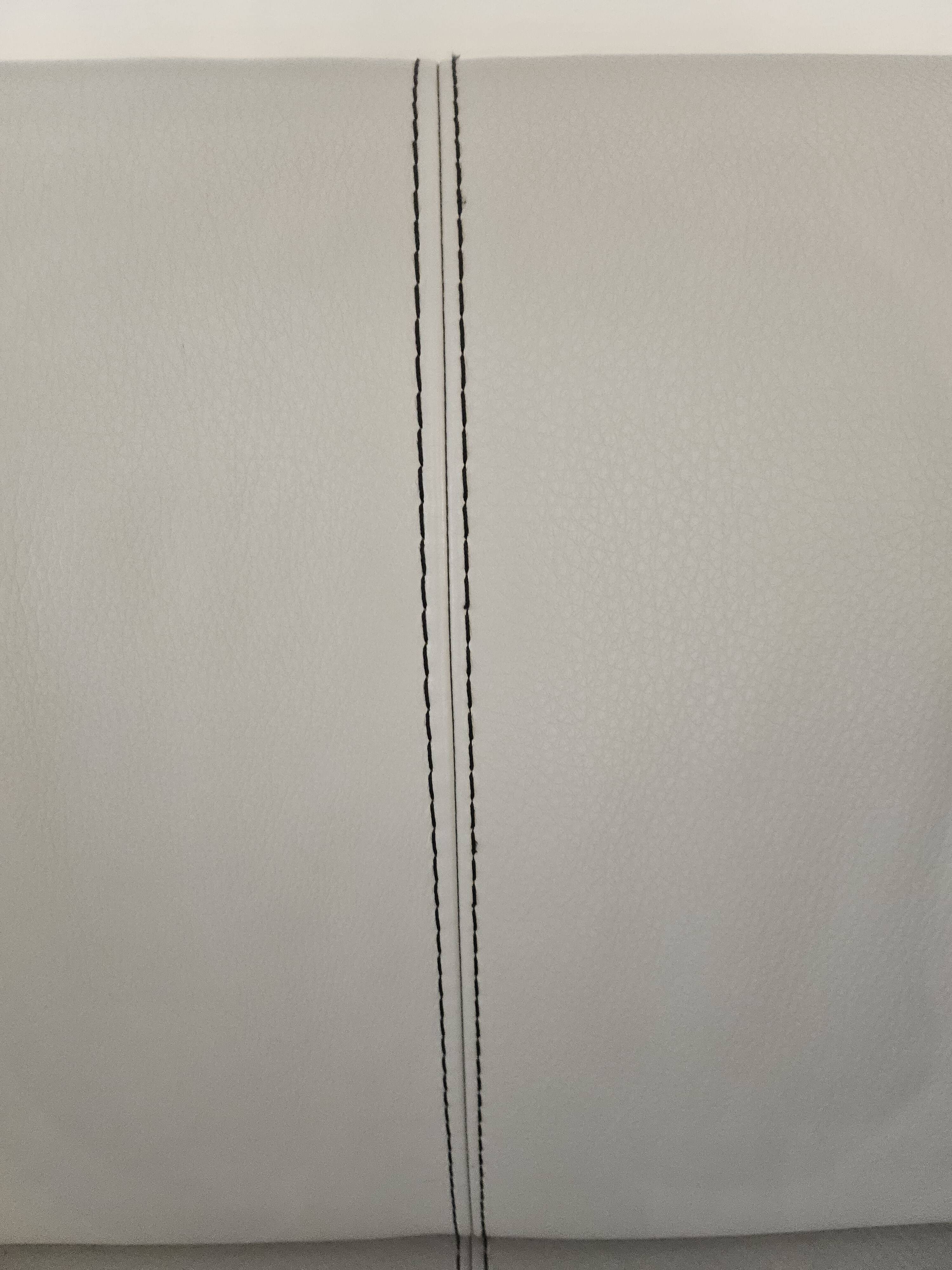 Two-seater sofa and a grey leather armchair Italia.